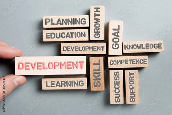 Fototapeta Wooden Blocks with Development Concept