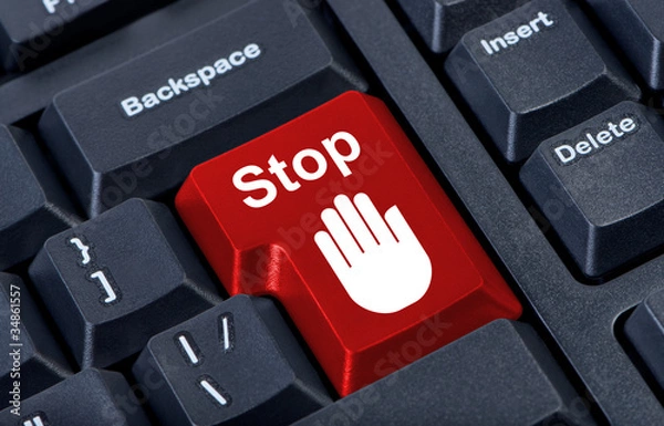 Fototapeta Button stop computer keyboard with hand icon.