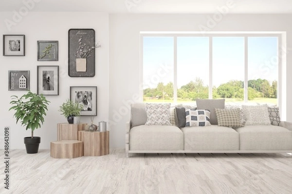 Obraz White living room with sofa and summer landscape in window. Scandinavian interior design. 3D illustration