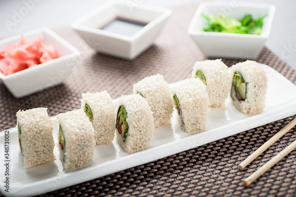 Fototapeta Uramaki sushi light maki on a dish