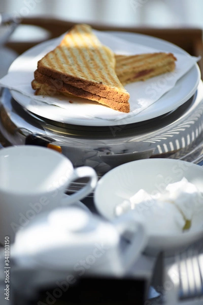 Obraz Sandwich in the Mediterranean breakfast in the sun layout on the white plate 