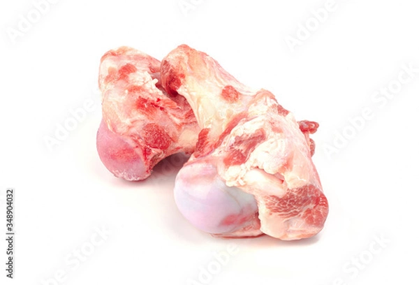 Fototapeta Close up frozen fresh pork bones with red meat stuck To be used for making pork bone broth on a white background