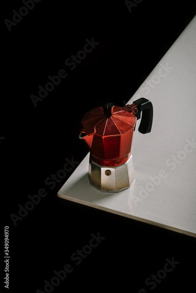 Obraz Italian coffee red cap on white table with black background
