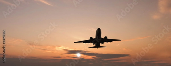 Obraz Airplane on sunset sky