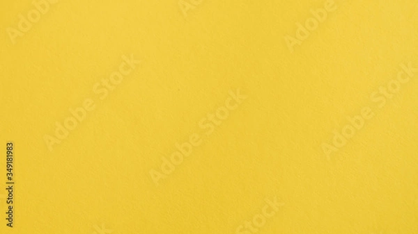 Fototapeta Yellow background. Yellow paper backdrop. Chrome color background. Amber, lemon, orange, saffron backdrop and text space