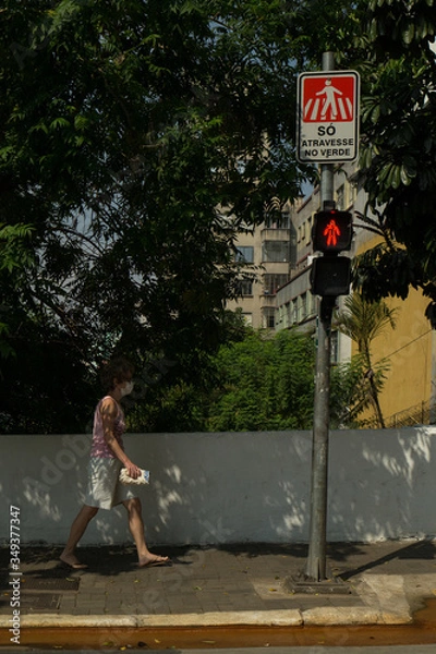 Obraz Woman going to buy supplies uses face mask to protect herself from the virus in the pandemic.