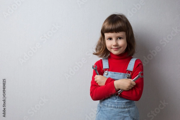 Obraz Girl playing auto mechanic, portrait