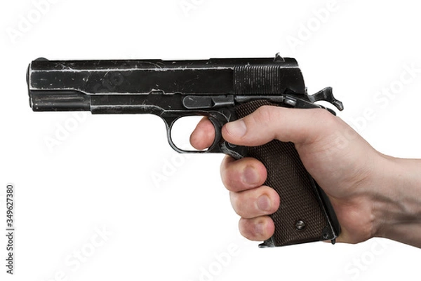 Fototapeta Legendary U.S. Army handgun Colt 1911A1 in male hand isolated on white background. Military model pistol from World War Two. (gray color).
