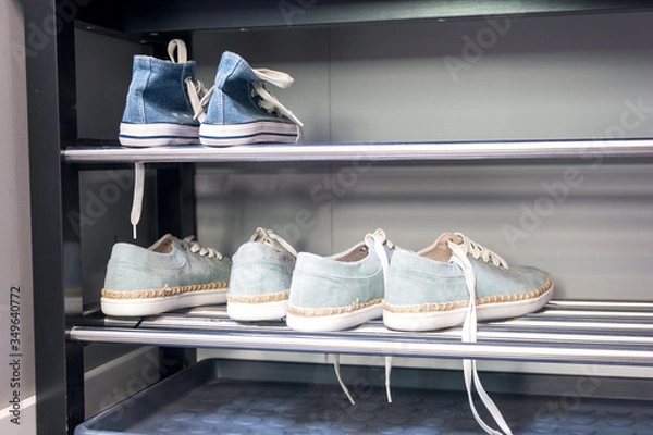 Obraz Shelving rack with shoes in hallway indoors