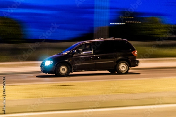 Fototapeta Monovolumen on road