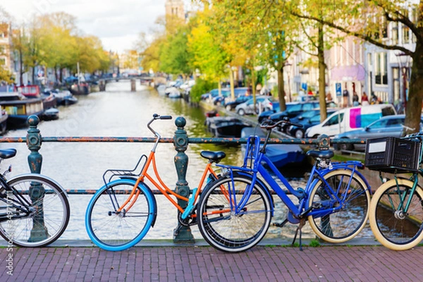 Fototapeta colorful bicycle on a canal bridge in Amsterdam