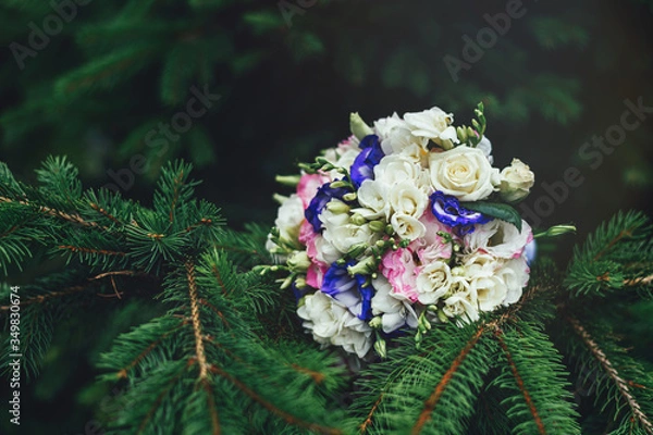 Fototapeta Beautiful colorful wedding bouquet on a green background. Copy space for text. Close-up. Soft focus. 