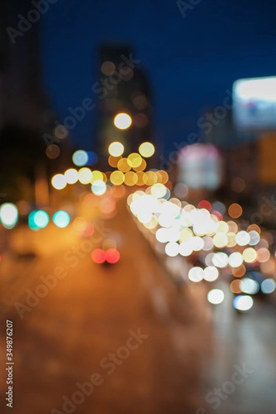 Fototapeta Blurred defocused lights of heavy traffic and blurred traffic road with colorful bokeh lights