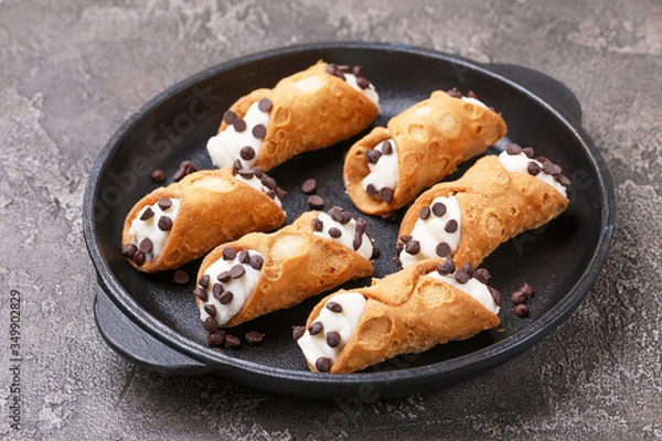 Fototapeta Sicilian dessert cannoli with chocolate