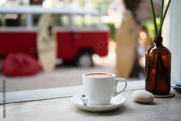 Fototapeta Hot coffee with a serving is prepared for the tourists who come to the sea in the morning.