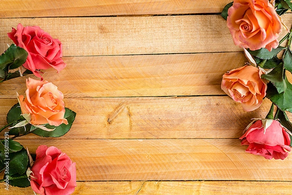 Fototapeta Handmade roses lie on a wooden background. Background layout with free text space.