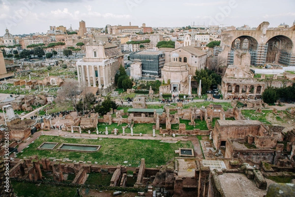 Fototapeta Roman Forum and Ruins of Septimius Severus Arch and  Temple of Saturn, Rome, Italy.