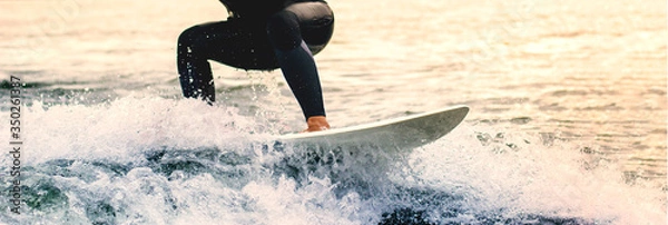 Obraz Dynamic water sports enthusiast shifts his focus on the wakeboard to keep the balance steadfastness fear water learning challenge