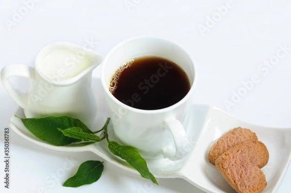 Fototapeta Organic coffee in a white mug with milk and raspberry cookies.