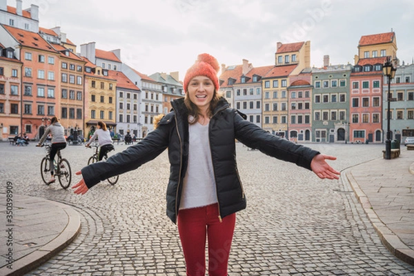 Fototapeta Young woman in the old town of warsaw, poland