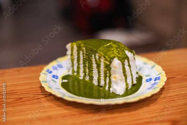Obraz Crepe Cake with green tea sauce