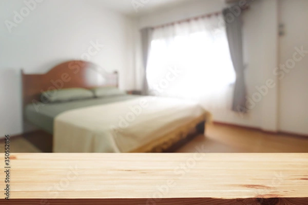 Obraz Bedroom and empty wooden desk space platform for product presentation.