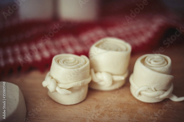 Obraz Parenica, traditional Slovak cheese rolls on wooden table background. Home made rolled cheese, sheep milk product