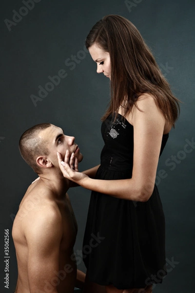 Fototapeta Topless young man kneels before his girlfriend