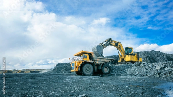Fototapeta Work of trucks and the excavator in an open pit