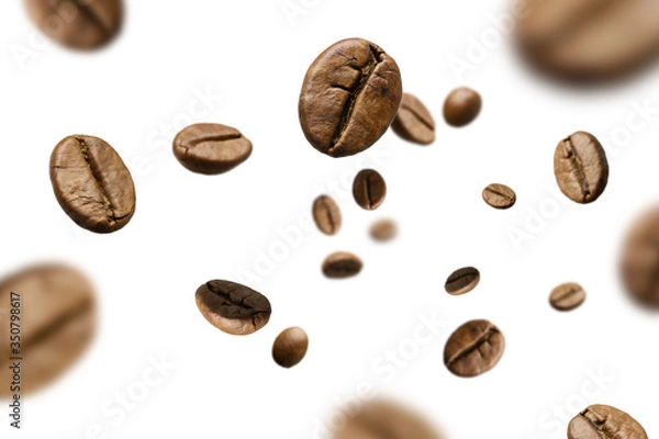 Fototapeta Brown roasted coffee beans falling and flying on black background.Represent breakfast for energy and freshness concept.