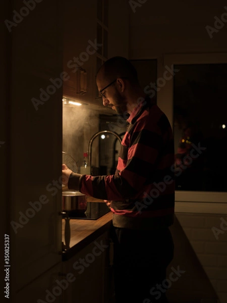 Obraz Cooking dinner at home in the evening