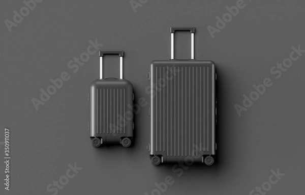 Fototapeta Black luggage set on dark background, top view image, flat lay composition. Travel minimalist concept, black and dark classic baggage mockup, small and big. Suitcase accessory set, journey concept.