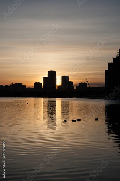 Fototapeta sunset over the river