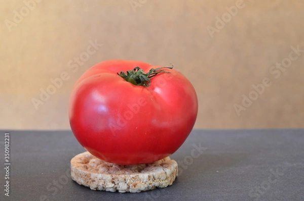 Fototapeta red tomato on a wheat bread 