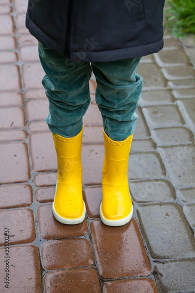 Obraz Boy in yellow boots in the rain