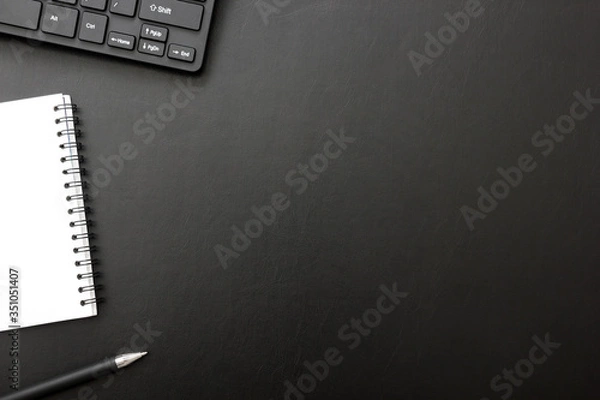 Fototapeta Black desk office with laptop, smartphone and other work supplies with cup of coffee. Top view with copy space for input the text. Designer workspace on desk table essential elements on flat lay