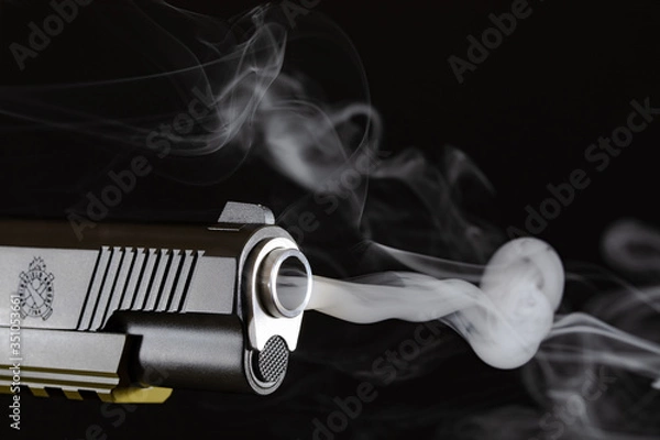 Obraz Springfield Operator 45 Cal with gun smoke