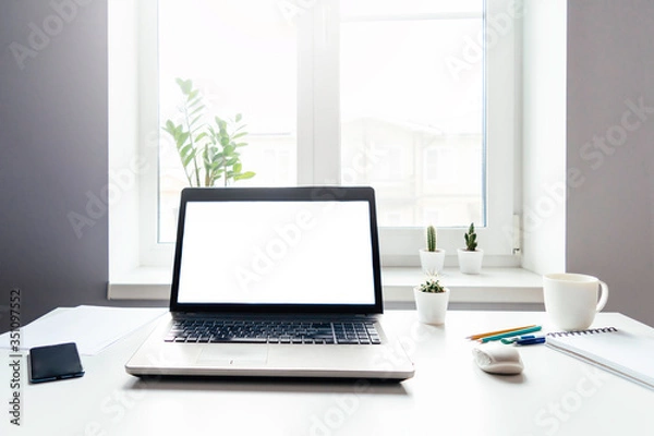 Fototapeta A table with laptop.