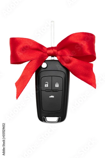 Fototapeta Car keys with red bow over white background. Isolate.