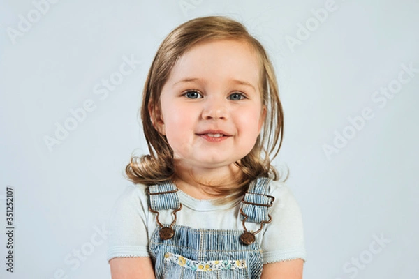 Fototapeta Portrait of 2 year old happy smiling baby on white background. 