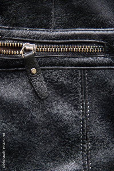 Fototapeta Back leather texture with open zipper on black leather
