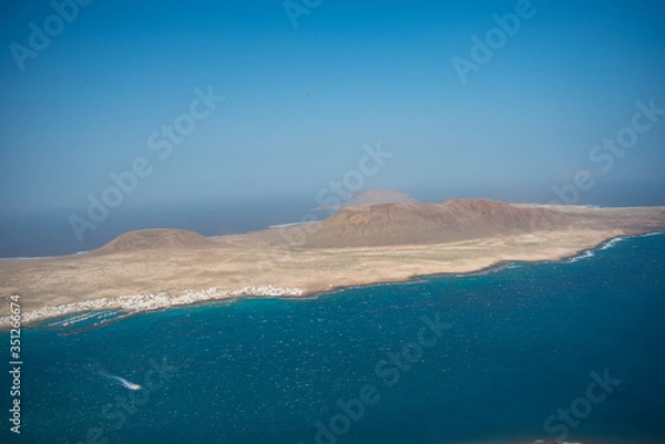 Fototapeta Aerial view on the coastline of Lanzarote island on a sunny day 