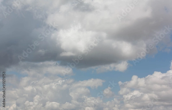 Fototapeta Blue sky with many background clouds