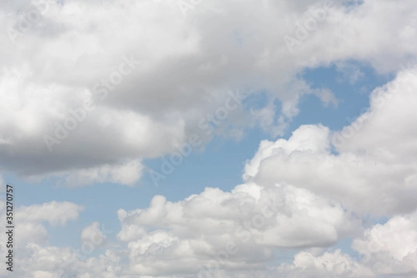Fototapeta Blue sky with many background clouds