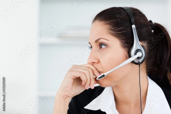 Fototapeta Cute young operator looking away