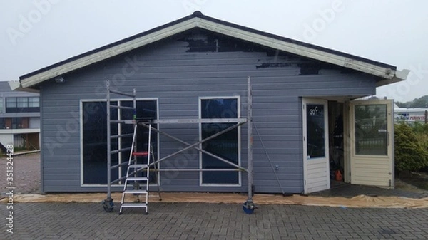 Obraz worker renovating a building