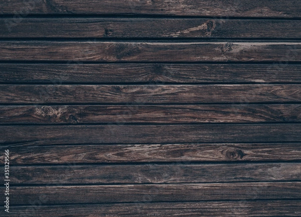 Fototapeta Wood plank texture background. A wooden board with a textured surface, scratches and patterns. Wooden fence, wood texture, wooden background.