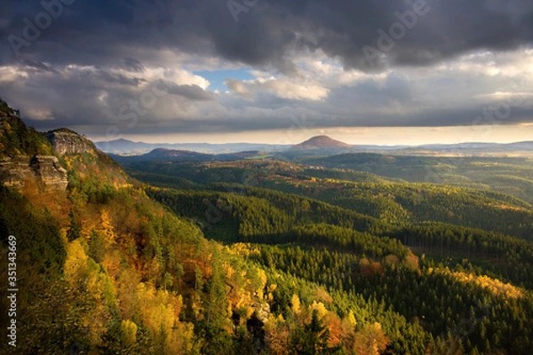 Fototapeta Autumn hills and forest with cliff