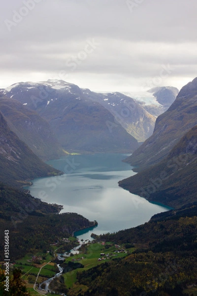 Fototapeta Scenic view of valley and nLovatnet near Via ferrata at Loen,Norway with mountains in the background.norwegian october morning,photo of scandinavian nature for printing on calendar,wallpaper,cover