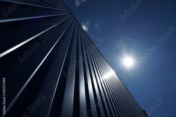 Fototapeta Factory barrels in industrial areas with aluminum as outer cladding photographed in summer